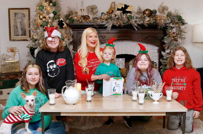 Tori Spelling poses with her family in Christmas clothes