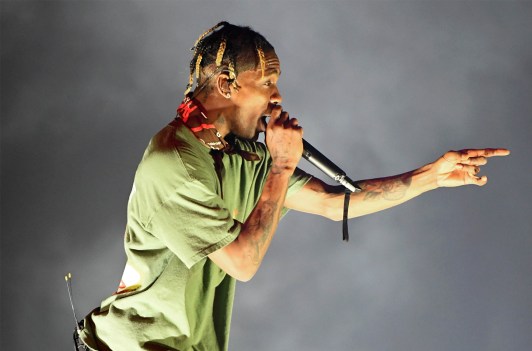 Travis Scott Performing and pointing to the audience
