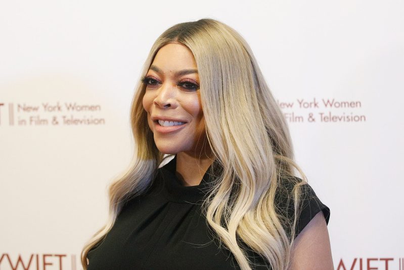 Wendy Williams smiling in a black dress