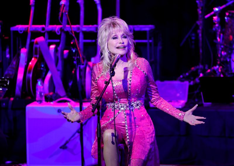 NASHVILLE, TENNESSEE - OCTOBER 24: Dolly Parton performs at the 2021 Kiss Breast Cancer Goodbye Concert at CMA Theater at the Country Music Hall of Fame and Museum on October 24, 2021 in Nashville, Tennessee.