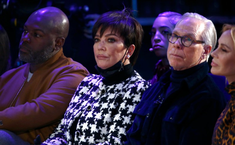Corey Gamble, Kris Jenner, and Tommy Hilfiger sitting together