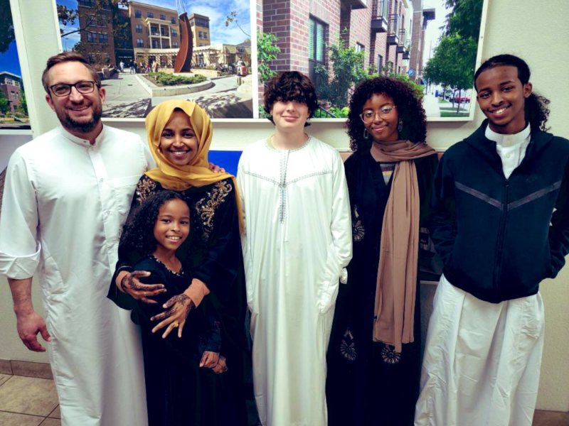 A family photo of Ilhan Omar, Tim Mynett, and their children