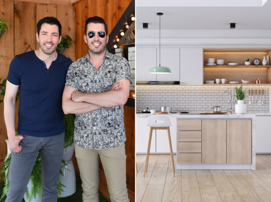 The property brothers standing next to a renovated kitchen