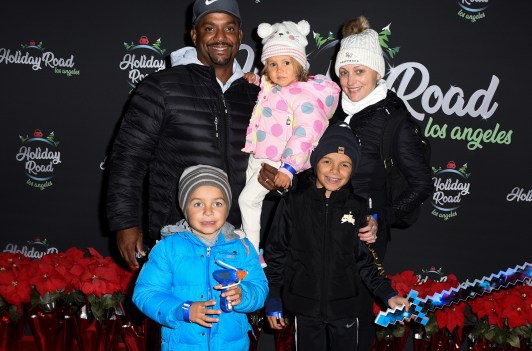 Alfono Ribeiro with his family at a red carpet event.