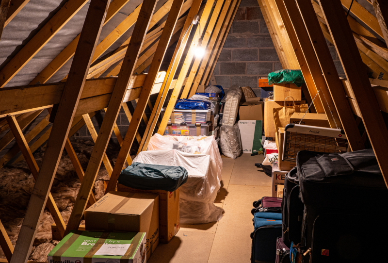 Messy attic storage, assorted piles of boxes