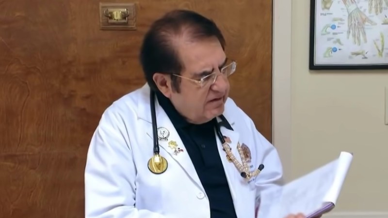 Dr. Now talks with a patient in his office