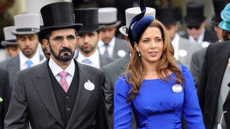 Sheikh Mohammed bin Rashid al-Maktoum and Princess Haya Bint al-Hussein walk during a royal event