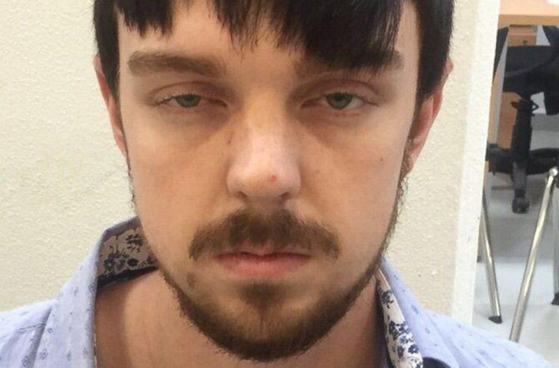 A close up photo of Ethan Couch in a police station