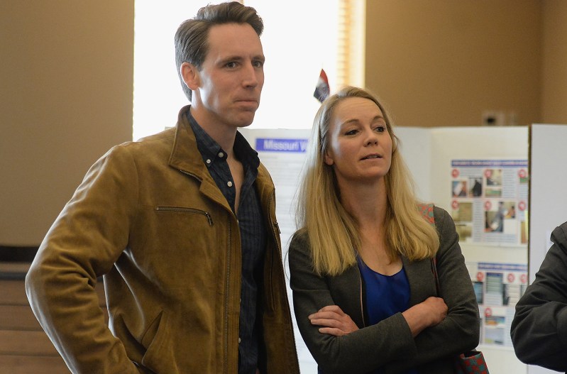 Josh Hawley (left) standing with his wife Erin Morrow Hawley waiting to vote in 2018.