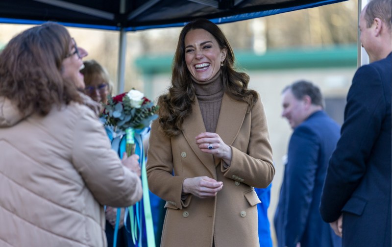 Kate Middleton wears a brown coat and top as she greets admirers