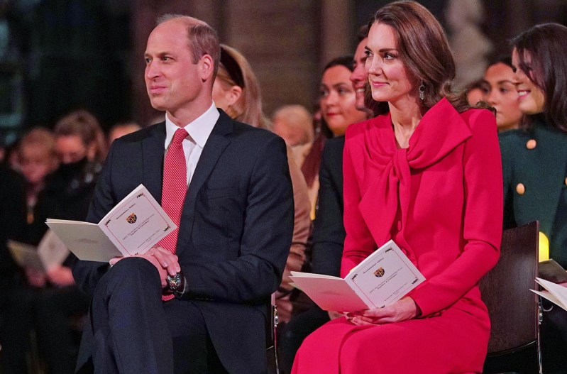 Prince William on the right sitting with Kate Middleton at a Christmas concert