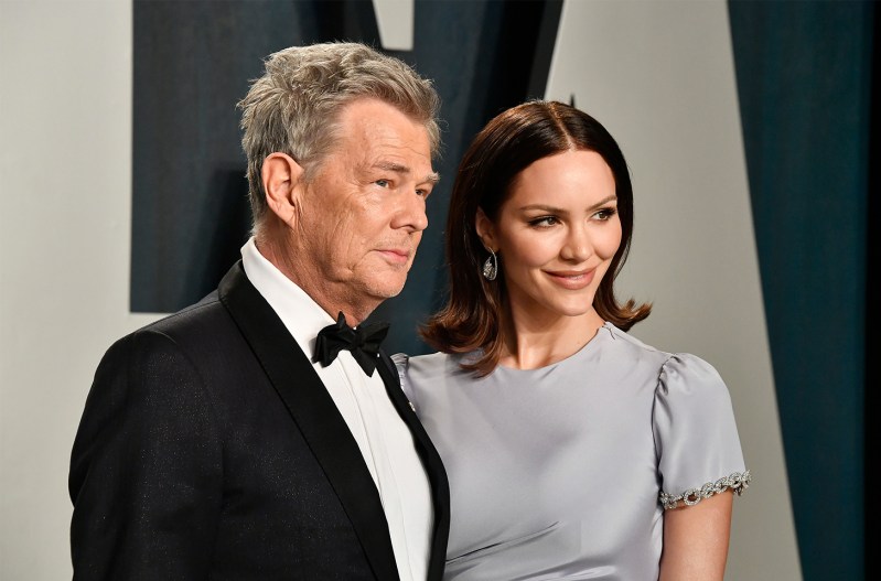 David Foster on the left, standing with Katharine McPhee on the right.