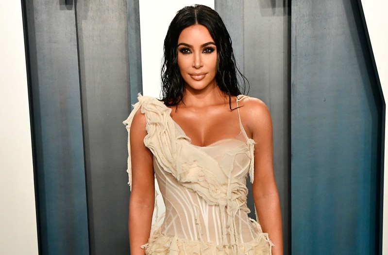 Kim Kardashian in a cream-colored dress