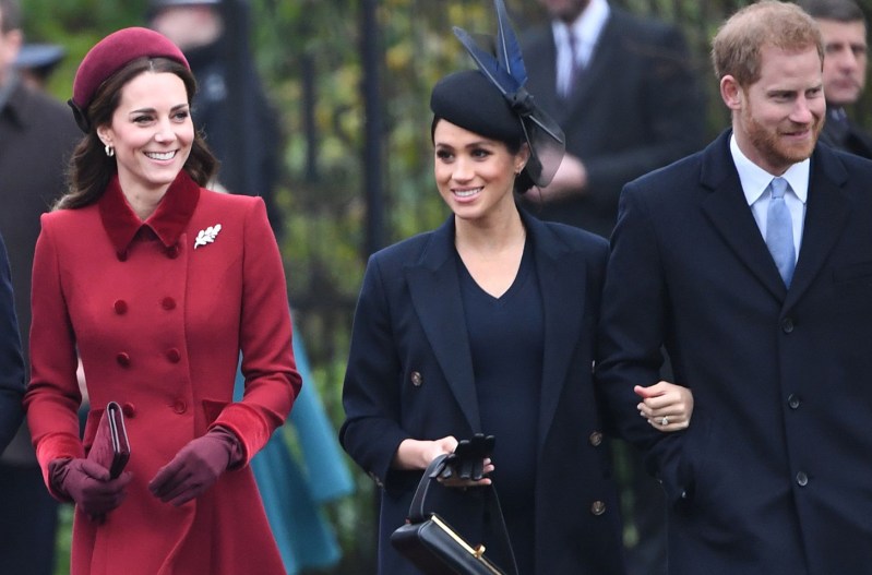 Kate Middleton on the left, walking with Meghan Markle (middle) and Prince Harry