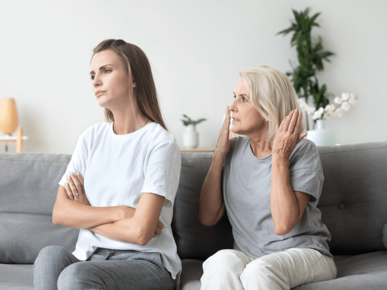 Angry aged mother quarreling, arguing with young daughter, bad family relationships concept, parent and child conflict, different age generations, stubborn woman ignoring annoyed mum