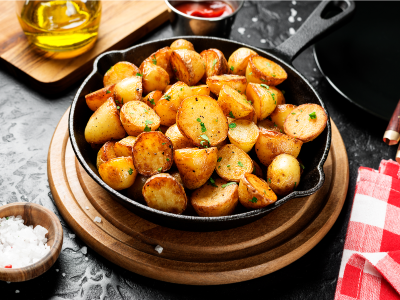 potatoes fried in a pan, rustic style, horizontal view from above