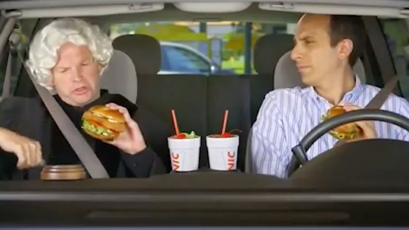 Screenshot of a Sonic commercial featuring T.J. Jagodowski and Peter Grosz sitting in a car