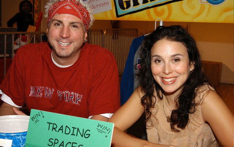 Trading Spaces hosts Scott Sicari and Jordin Ruderman sit together at a children's benefit