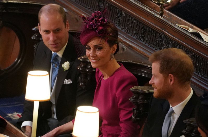 Kate Middleton sitting between Prince William and Prince Harry