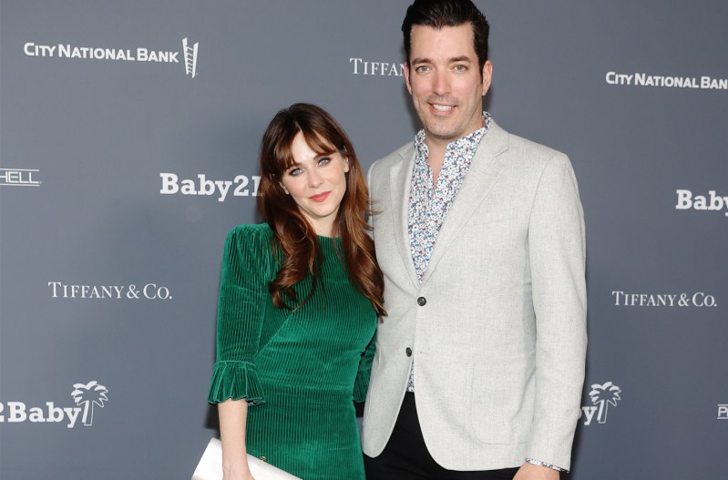 Zooey Deschanel in green, standing next Jonathan Scott in a white jacket