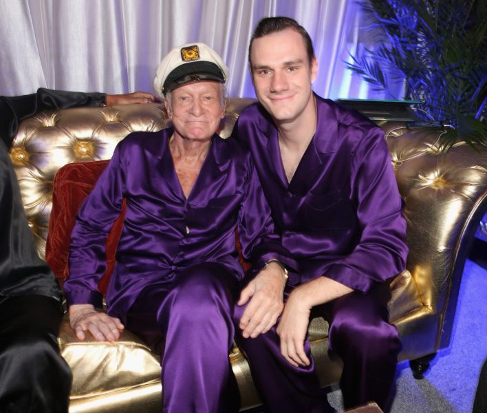 AUGUST 16: Hugh Hefner (L) and Cooper Hefner attend the Annual Midsummer Night's Dream Party at the Playboy Mansion hosted by Hugh Hefner on August 16, 2014 in Holmby Hills, California.