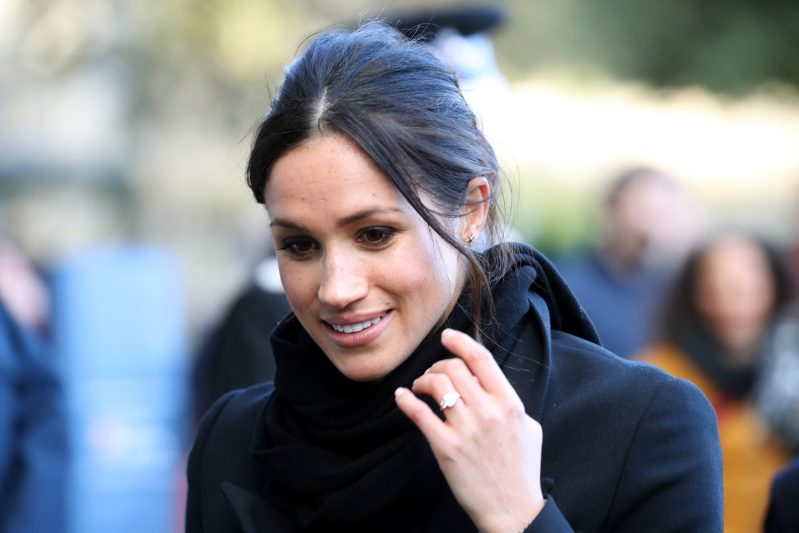 Meghan Markle with her hand near her face, with her ring on display