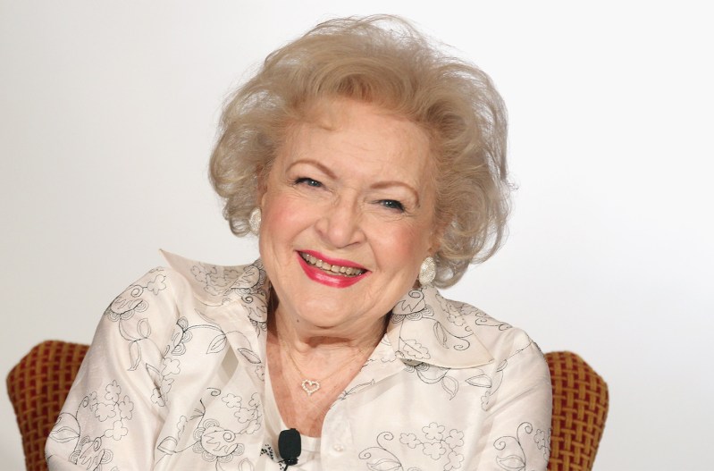 Betty White smiling in front of a white background