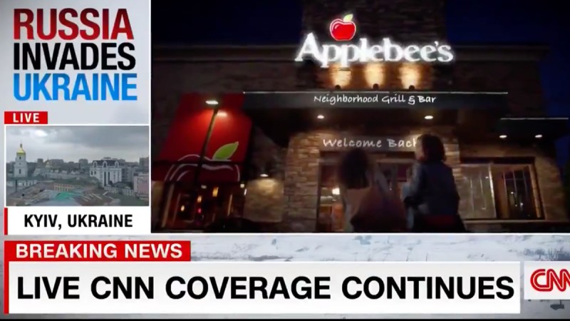 Screenshot of an Applebee's ad playing over CNN's coverage of the Ukraine crisis.