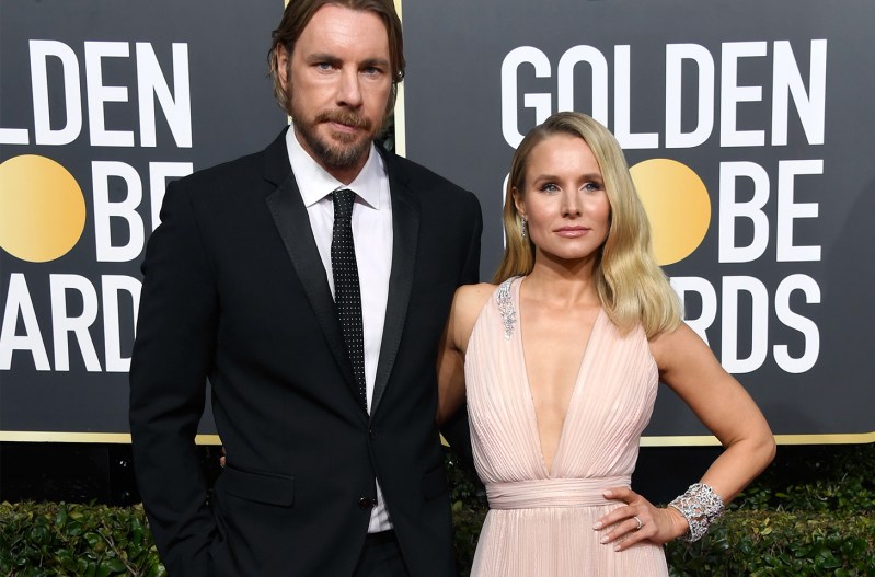 Dax Shepard on the left, standing with Kristen Bell on the right at the Golden Globe Awards