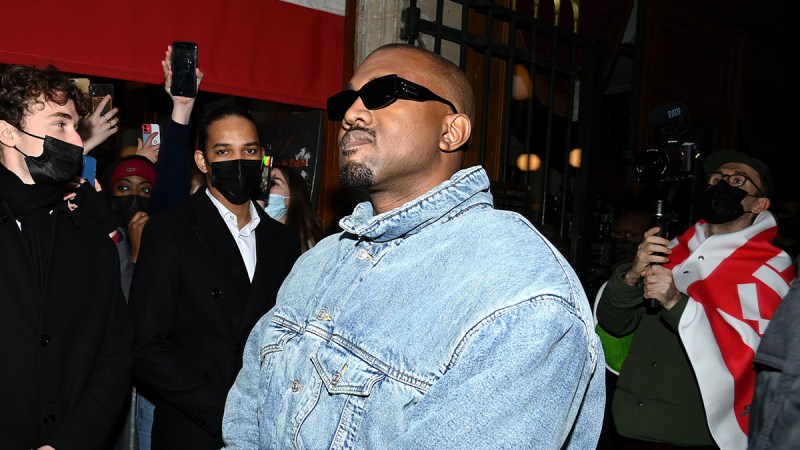 Kanye West in sunglasses and a denim jacket
