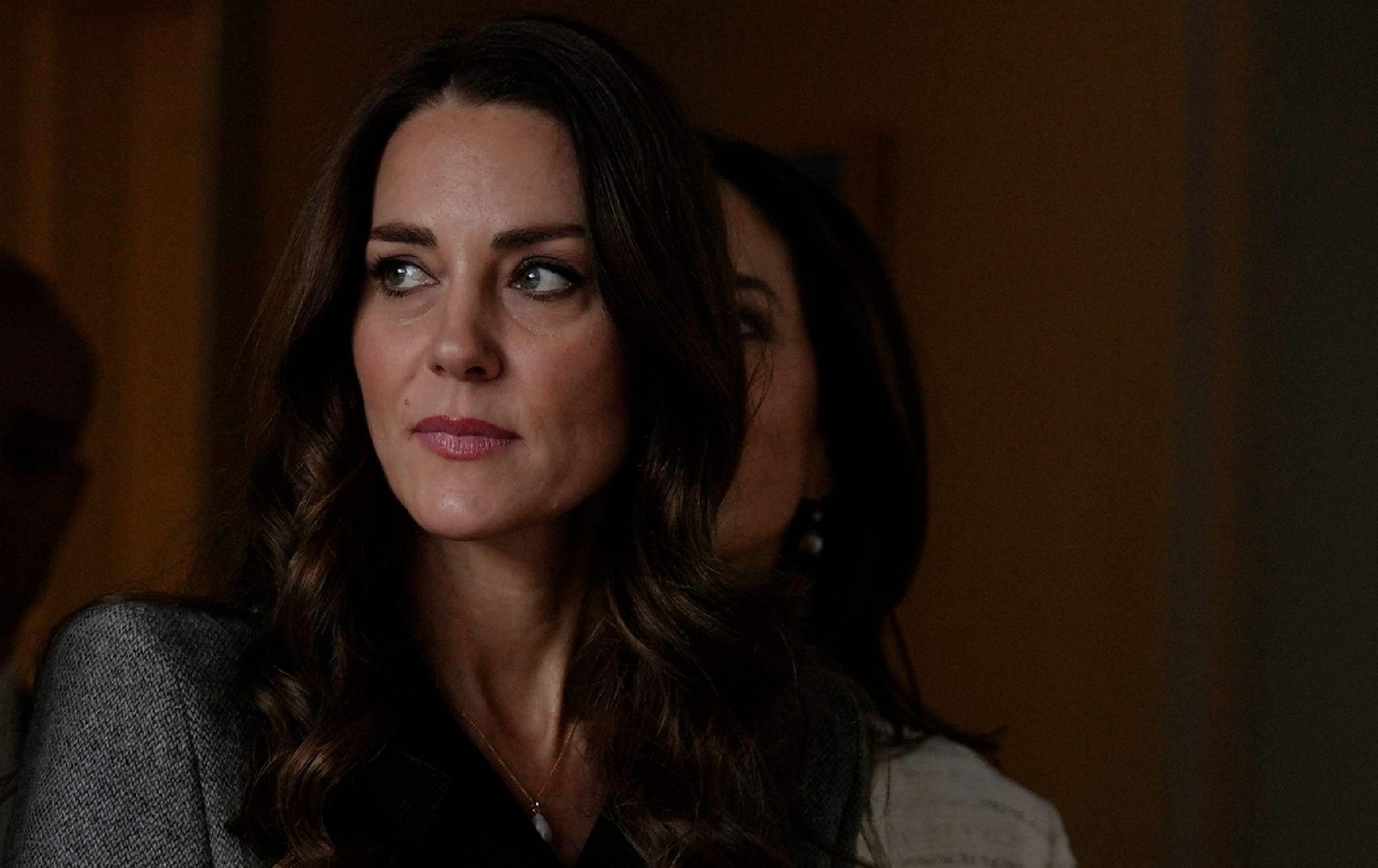 Kate Middleton wears a gray winter coat as she enters a building in Copenhagen, Denmark