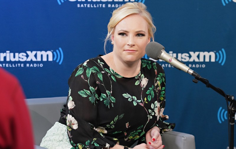 Meghan McCain wears a floral top and white skirt during a SiriusXM interview