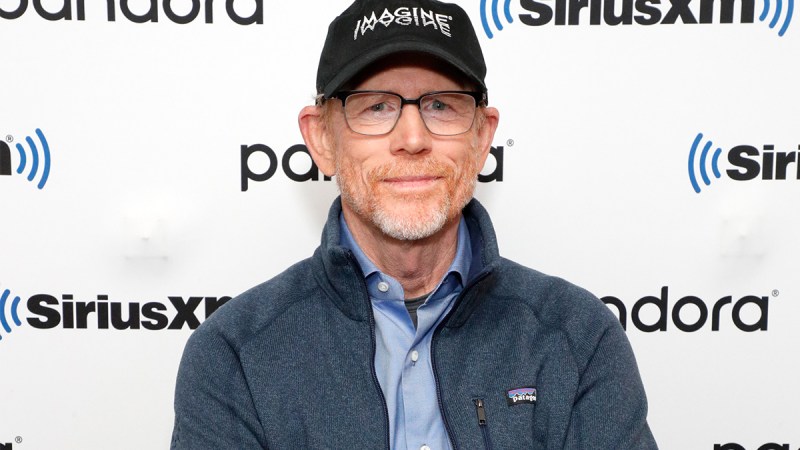 Close up of Ron Howard in a hat and wearing glasses.