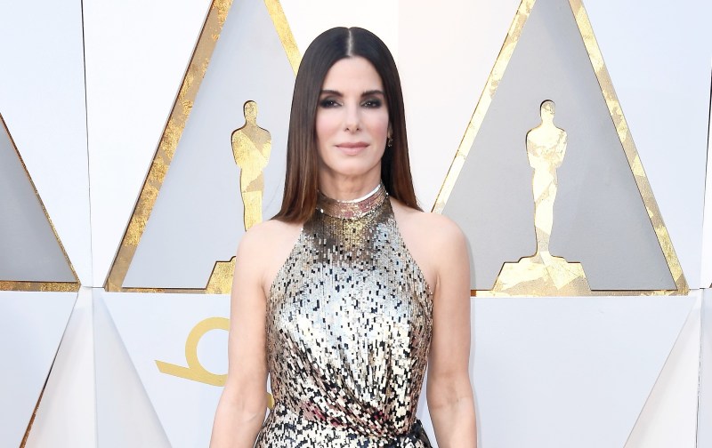 Sandra Bullock wears a silver halter dress on the Oscars red carpet