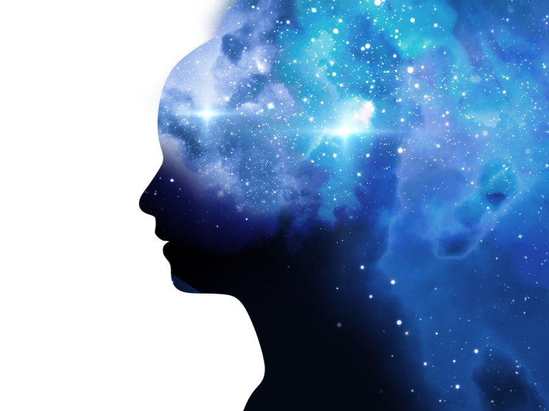 silhouette of virtual human with aura chakras on space nebula , represent meditation,yoga and deep sleep therapy.