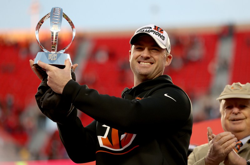 Zac Taylor holding up the trophy for winning the AFC Championship