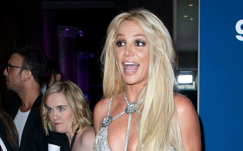 Britney Spears shouting in a silver dress