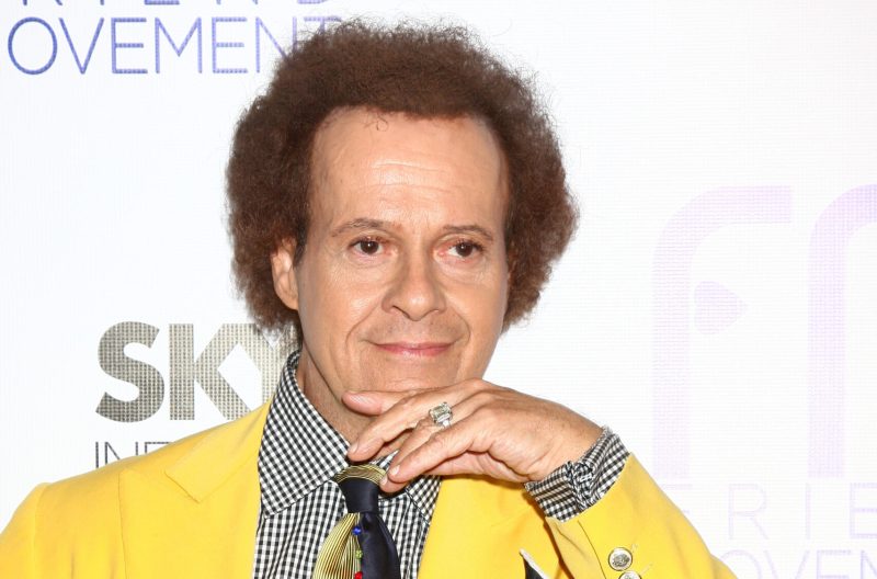 Richard Simmons wearing a yellow jacket in 2013