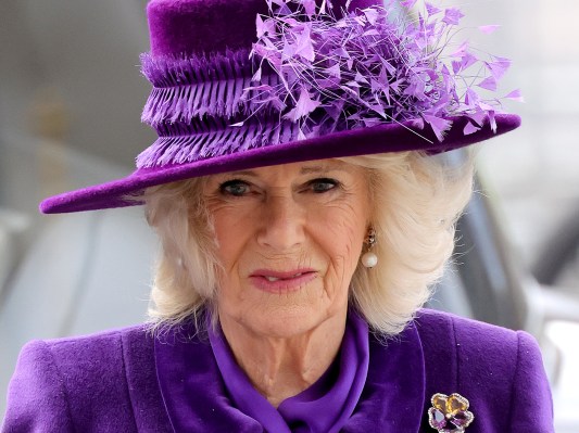 Camilla Parker Bowles wearing a purple hat and purple dress