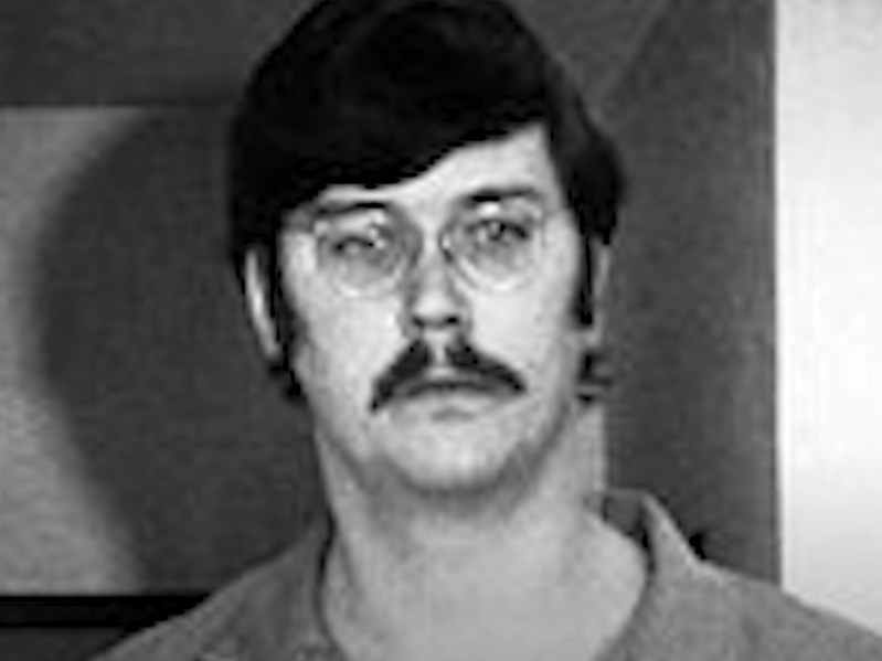 Black and white photo of Ed Kemper wearing prison jumpsuit