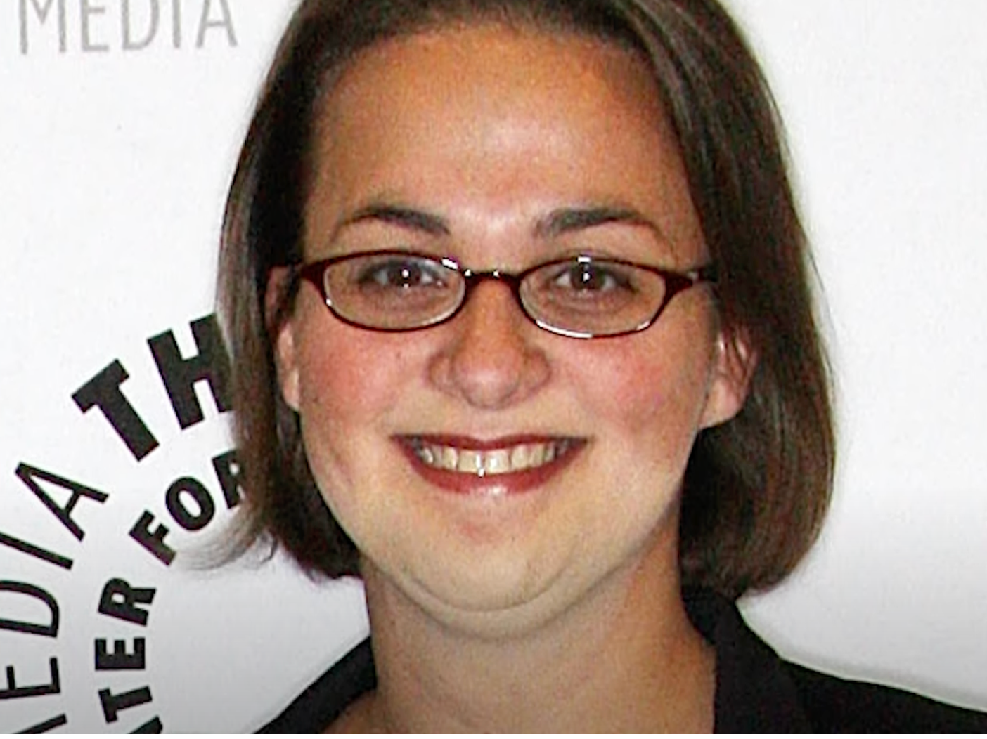 Closeup for Elisabeth Finch smiling with glasses on