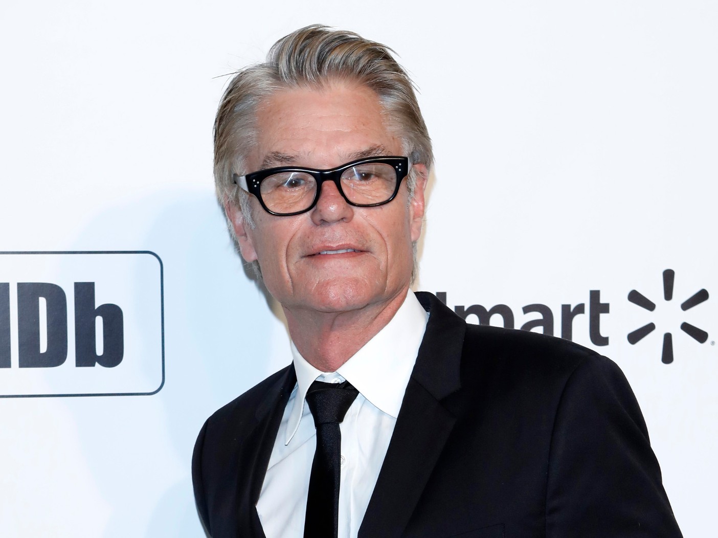 Harry Hamlin in black suit and tie