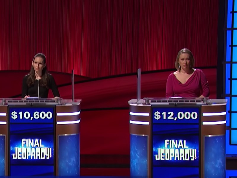 Two contestants on Jeopardy! consider their answers to the final question on set