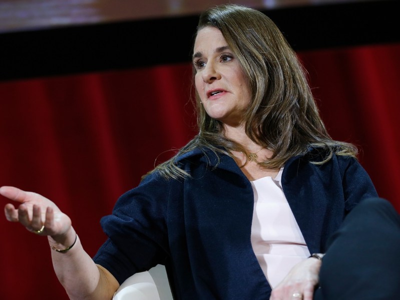 Melinda Gates wearing blue jacket giving interview