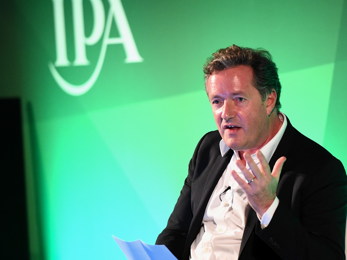 Piers Morgan speaking in black blazer