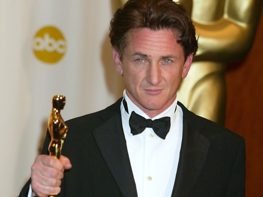 Sean Penn holding Oscar award
