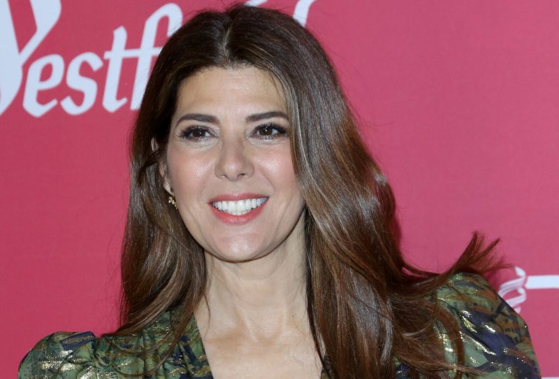 Marisa Tomei smiling on the red carpet.