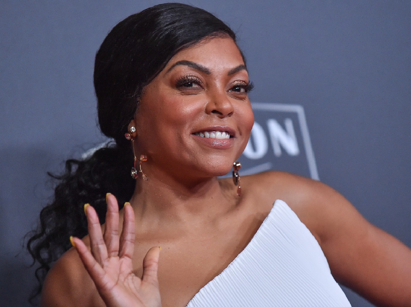 Taraji P. Henson wears a white dress on the red carpet