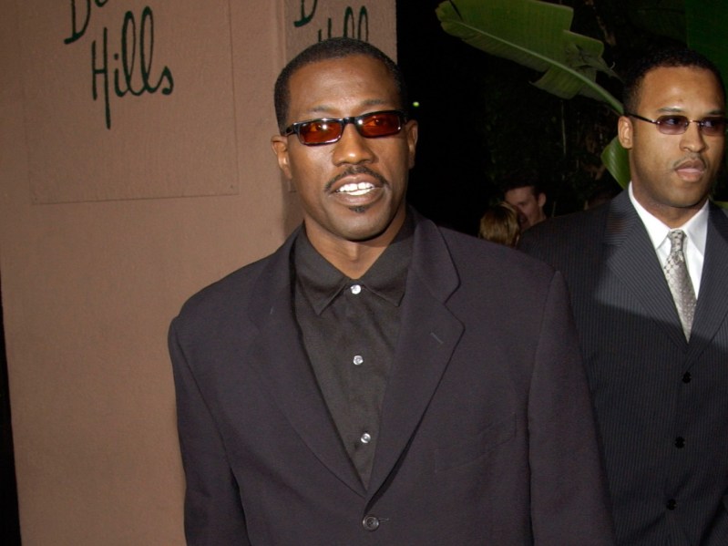 Wesley Snipes wears a dark colored suit outside of the Beverly Hills Hotel
