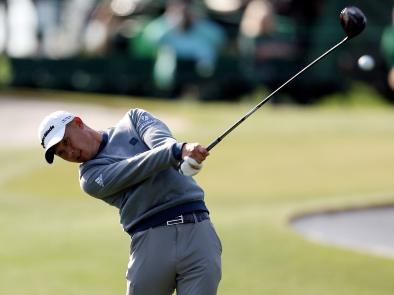 Action shot of Collin Morikawa golfing